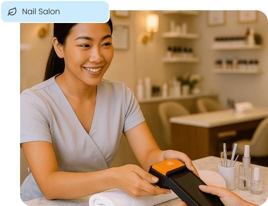 A nail technician completes an in-person sale, representing how Aurora Payments' solutions connect a salon's ecommerce and online booking with their physical point-of-sale.