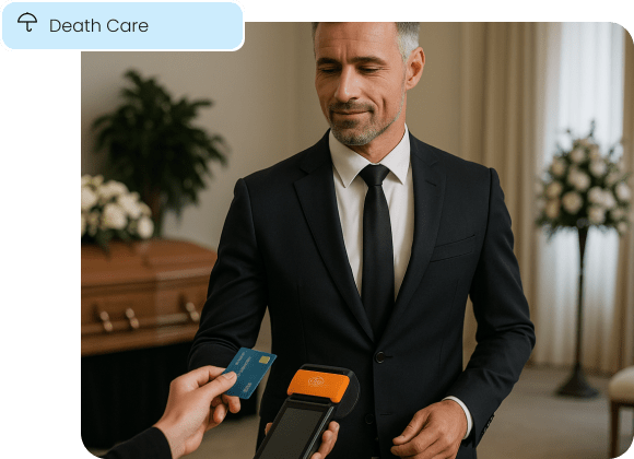 A funeral director accepts a discreet, flexible in-person payment for an invoice.