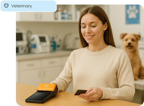 A client makes a payment at the front desk of a veterinary clinic, illustrating modern point-of-sale solutions for veterinary services.